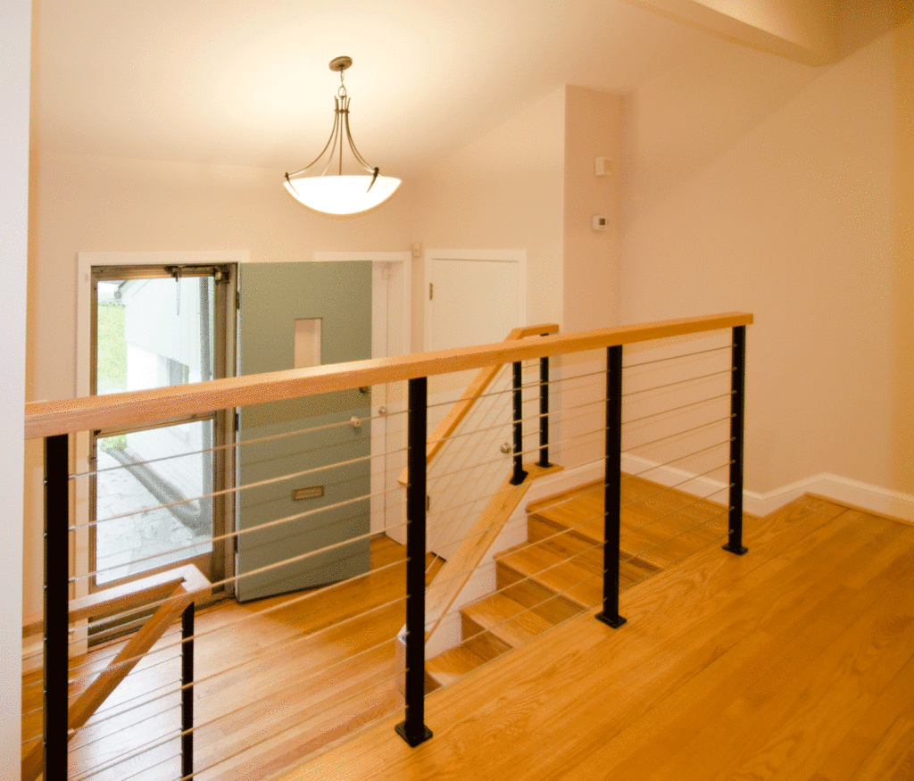 Split Level Partial Wall Railing - How to choose the right staircase for your home : A farmhouse stair railing might not be at the top of your list when refreshing your home, but we think it should be given a higher priority.
