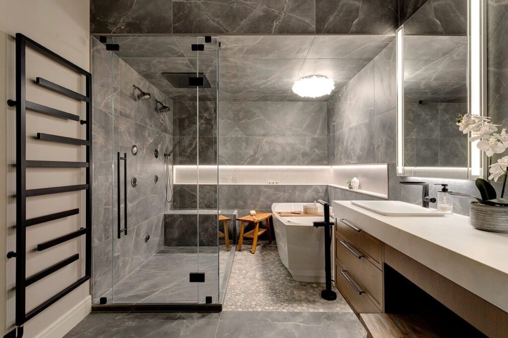 dark gray tile shower with glass doors